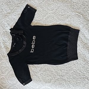 Super cute Bebe sweater. I would say- size S